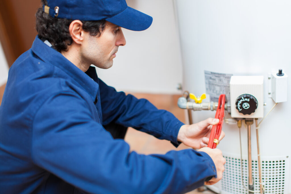 Plumber fixing a water heater